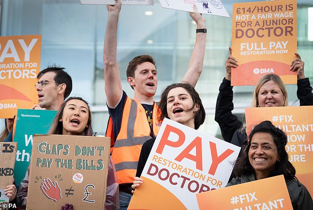 It comes as more and more doctors quit due to deteriorating working conditions and poor wages.  Many are also retiring in their 50s, moving abroad or working in the private sector due to rising demand.  Pictured yesterday are doctors and consultants on the picket line outside University College Hospital in London