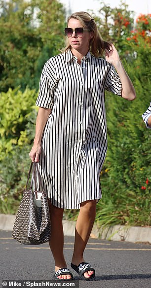Chic: Anna donned a leggy outfit in a striped shirt dress for filming