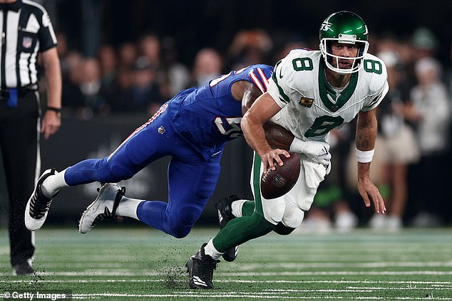 Aaron Rodgers hurt his ankle when he was sacked by Leonard Floyd minutes after his Jets debut