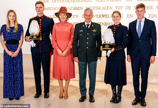 Princess Elisabeth of Belgium, 21, beamed with joy after becoming an officer at the Royal Military Academy last night