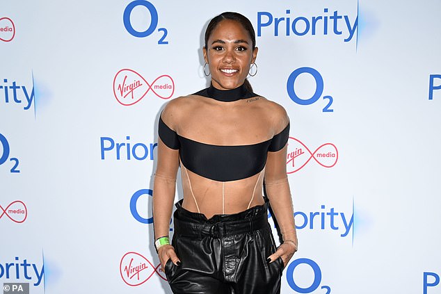 Stunning: Alex Scott, 38, showed off her incredible physique as she showed off plenty of skin in a black Bardot top as she attended Kylie Minogue's intimate concert on Wednesday night