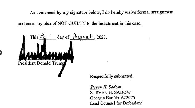 Trump entered a not guilty plea earlier in the day — seen here with his famous signature — avoiding a potential TV spot