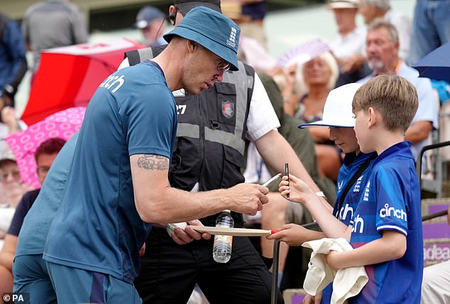 Andrew Flintoff signs autographs for fans as he continues his new role with the England team