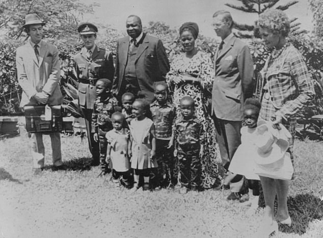 During his time in the King's African Rifles, Grahame had Idi Amin, later dictator of Uganda, under his command (the Ugandan leader is pictured with his wife and seven children, along with Major Iain Grahame, far left)