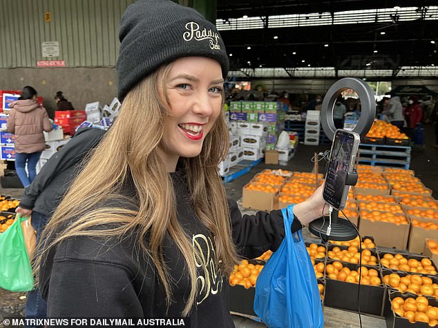 Inflation in Australia has risen by 5.2 percent, in an ominous sign that the cost of living crisis is far from over (pictured is a shopper at Paddy's Market in Sydney)