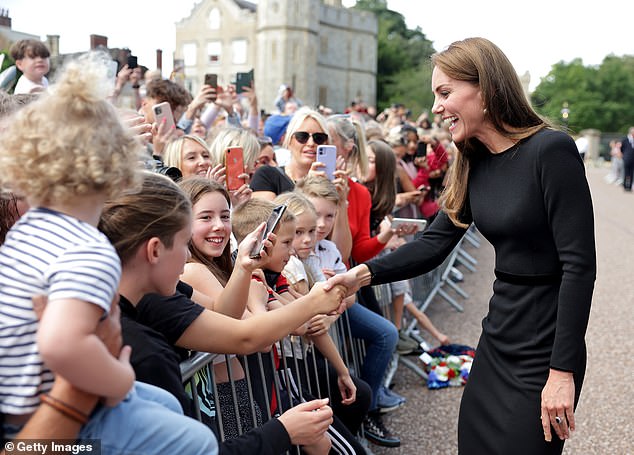 The Princess of Wales was pictured talking to the public at Windsor Castle as she viewed flowers and tributes to HM Queen Elizabeth on September 10, 2022.