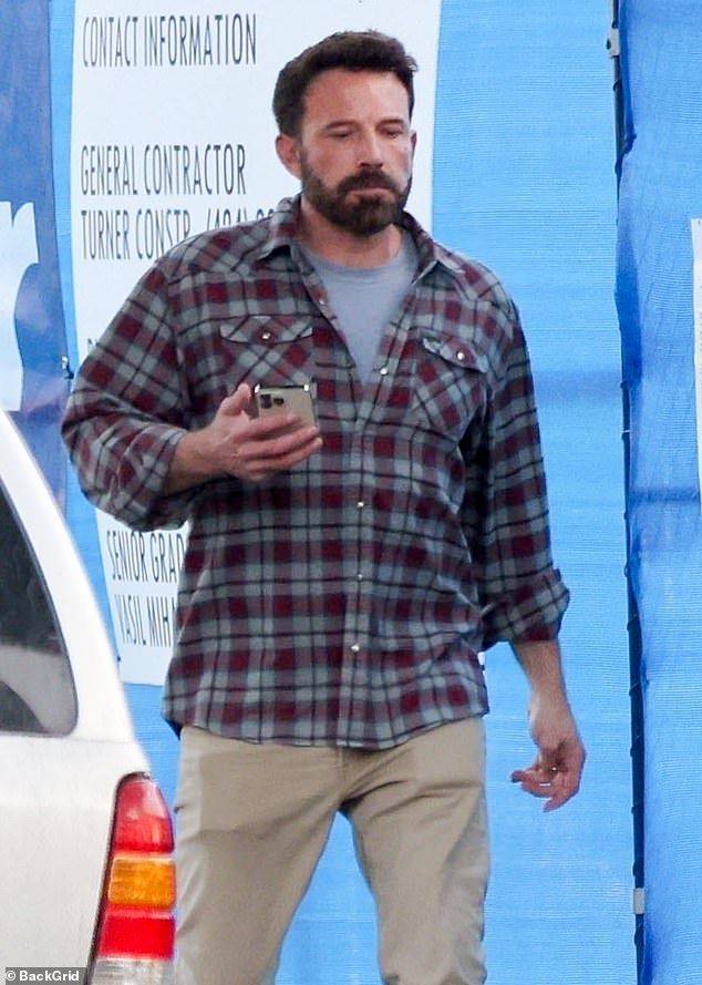 Casual-cool: Ben Affleck, 52, opted for one of his favorite looks in a plaid shirt with tan fitted pants as he headed to a meeting in Lod Angeles, which could be related to his next film job