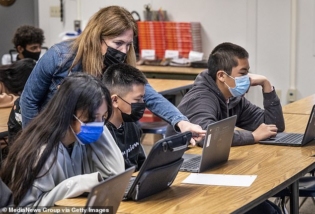 In January 2022, we see children wearing face masks in the classroom in California