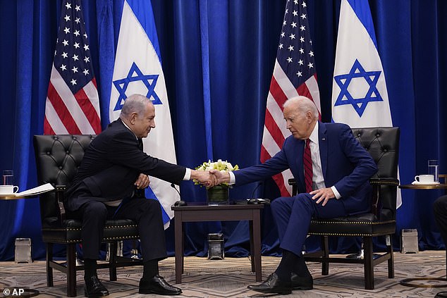 President Joe Biden shook hands with Israeli Prime Minister Benjamin Netanyahu in New York on Wednesday as hundreds of demonstrators gathered outside to protest Netanyahu's proposed judicial review.