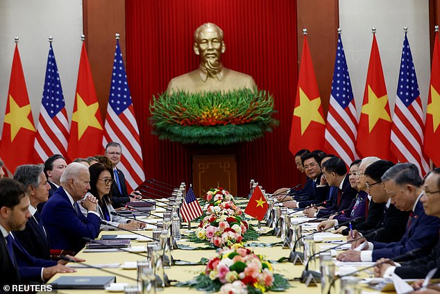 President Joe Biden (left) attends a meeting with Vietnam Communist Party Secretary General Nguyen Phu Trong (right) at the Communist Party of Vietnam headquarters in Hanoi, Vietnam