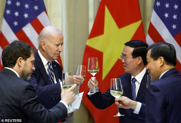 Salud!  Vietnamese leaders toasted President Joe Biden's health on a day when he met with business leaders and top government figures and visited a memorial for his late friend Senator John McCain