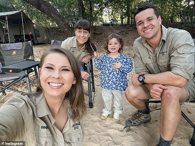 Bindi Irwin, 24, revealed on Tuesday she has a 'second chance at life' following her endometriosis operation in America, after suffering for a decade.  Pictured with her mother Terri, daughter Grace and husband Chandler Powell