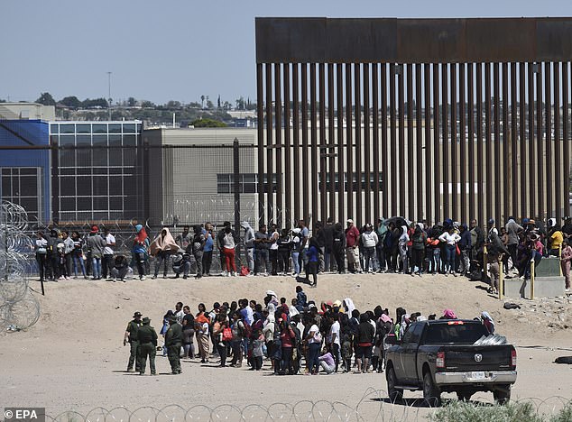 Migrants wait on the U.S. side of the border after members of the U.S. National Guard dismantled their encampment near Ciudad Juarez, Mexico, September 19, 2023. There were 8,000 migrant apprehensions at the southern border on Monday.