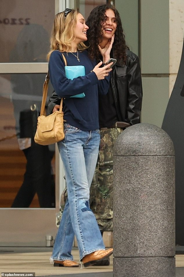 Love: Lily-Rose Depp, 24, and her friend 070 Shake, 26, showed love as they stepped out together in San Diego on Friday