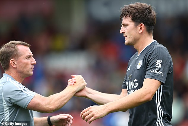 Harry Maguire spent two seasons at Leicester City, where he played under Celtic boss Brendan Rodgers (left)