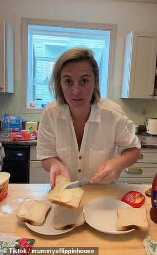 The content creator states that the trick is not to toast the bread as she spreads a thick layer of butter on a slice of bread before adding ketchup and bacon.