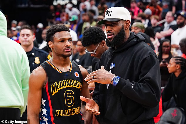 Bronny James (left) speaks with his father LeBron during the McDonald's All-American game