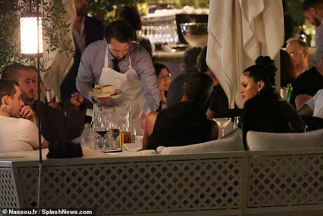 Drinking buddies: Brooklyn Beckham dined with his good friend Selena Gomez and a group of other friends on Wednesday night - but his wife was nowhere to be seen