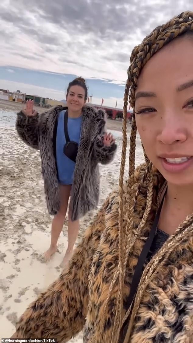 Christine Lee, who visited the festival with her friends, said they walk around in the muddy, sinking sand because their shoes keep getting caught