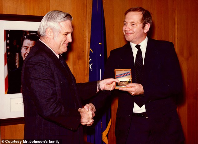 The CIA has identified Ed Johnson as the second officer involved in the Argo mission.  Above, Johnson (right) is seen being presented with the CIA's Intelligence Star by then-Deputy Director of Operations John N. McMahon, in a photo provided by Johnson's family