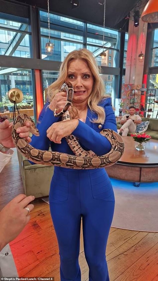 Scary: She may have faced her fears in the jungle of I'm A Celeb, but Carol screamed when she came face to face with Boa constrictor snakes on Wednesday's Steph's Packed Lunch