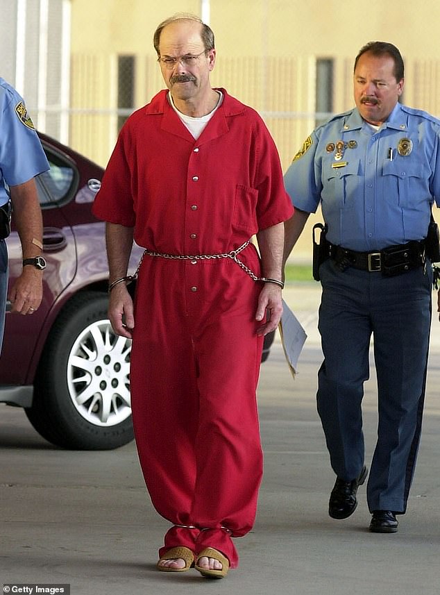 IMAGE: Prolific serial killer Dennis Rader, aka BTK, is pictured in 2005 after his arrest.  Investigators hope to connect him to other unsolved crimes