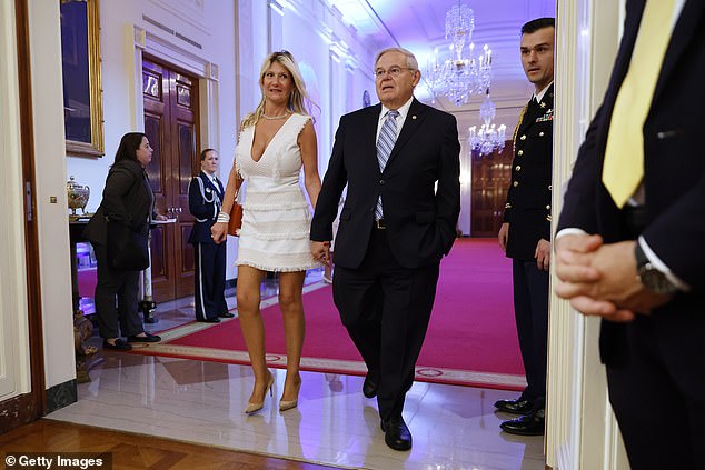 Senate Foreign Relations Committee Chairman Bob Menendez (D-NJ) and his wife Nadine Arslanian are accused of having an improper relationship with businessmen who used the senator's position for their enrichment.  The couple are pictured at the White House in May 2022 - both denying the allegations of corruption against them