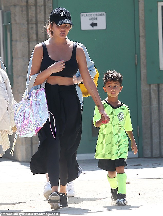 Bond: Chrissy Teigen was seen holding hands with her five-year-old son Miles in Los Angeles on Sunday