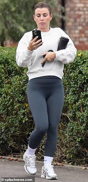 Sporty: The WAG, 37, who is married to footballer-manager Wayne Rooney, also 37, puts on a causal display in her stylish gym clothes