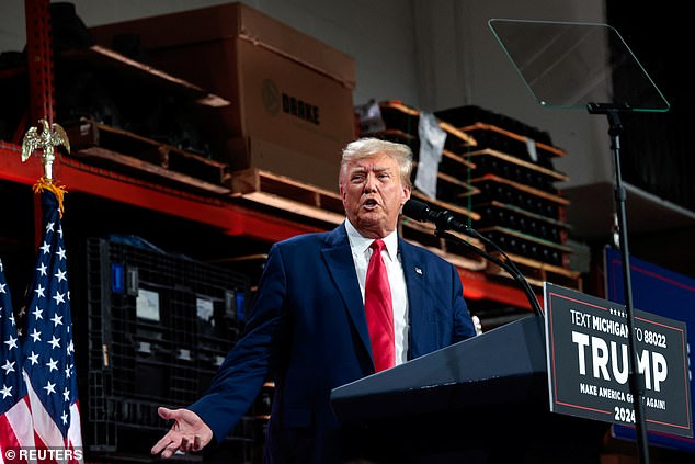 Former US President Donald Trump addresses auto workers as he skips the second GOP debate, in Clinton Township, Michigan, US, September 27, 2023