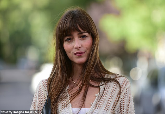 Brunette beauty: Her gorgeous brunette hair fell past her chest and her signature bangs were partially swept to the side