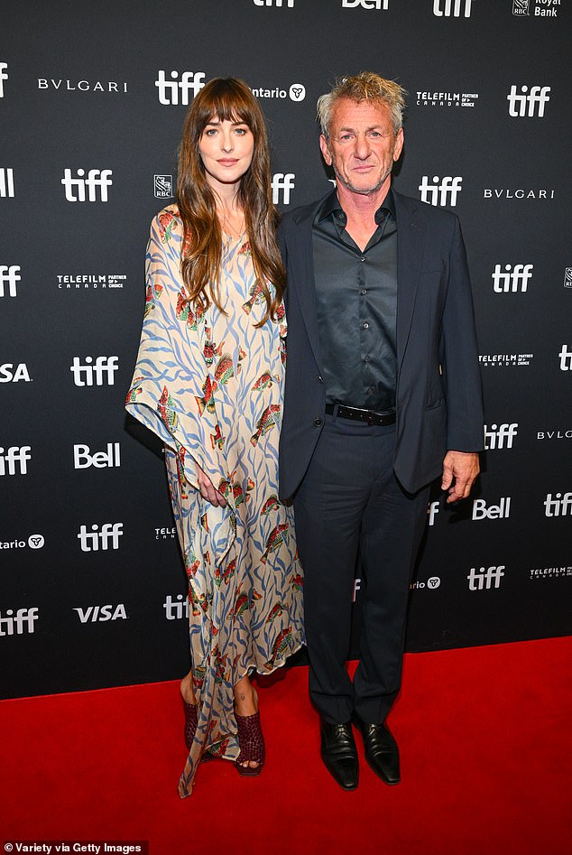 A-list duo: Johnson, 33, was joined by her co-star Sean Penn on Sunday and the pair posed for photos together on the red carpet