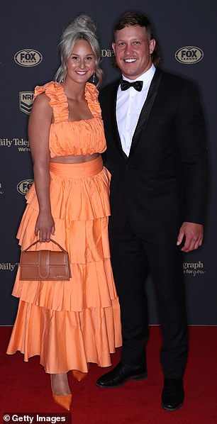 Reuben Cotter of the Cowboys affiliate Mackenzie Falco immediately caught the camera's attention when she donned an eccentric orange two-piece coordinate with ruffles