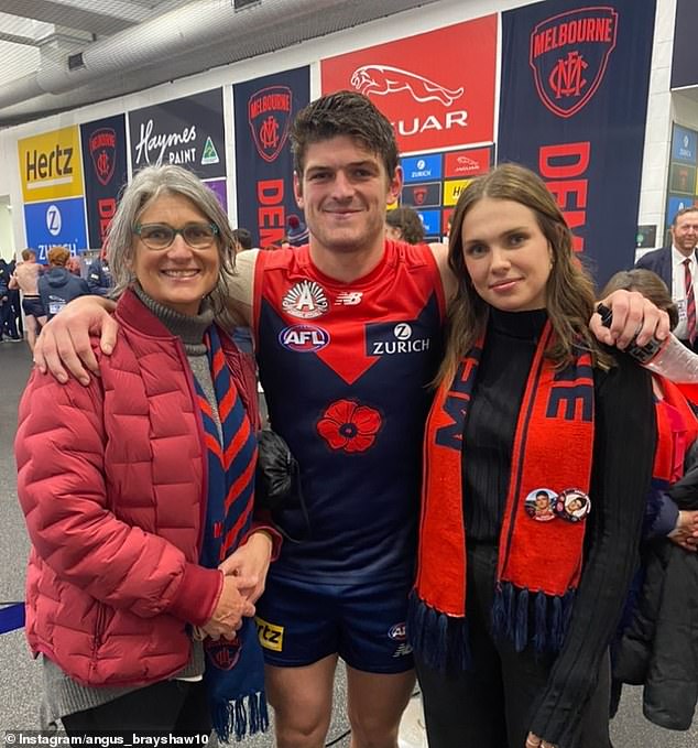 Demons star Angus Brayshaw is pictured with mum Deb and fiance Danielle (right)