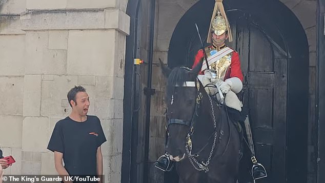 A young man was treated to the kinder side of a member of the King's Life Guard in London on Tuesday