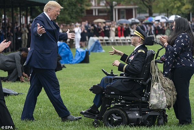 President Donald J. Trump greets Army Captain Luis Avila during the Armed Forces Welcome Ceremony honoring the 20th Chairman of the Joint Chiefs of Staff Mark Milley at Joint Base Myer in Virginia, U.S., September 30, 2019