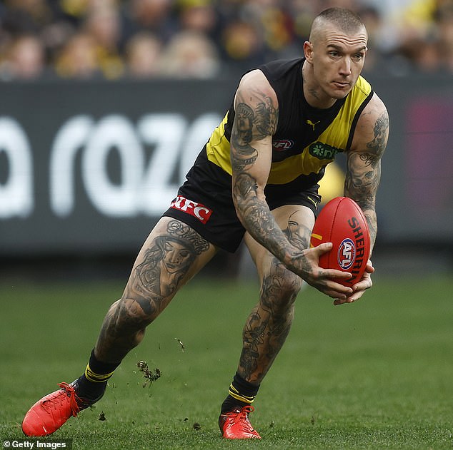 AFL superstar Dustin Martin has been spotted taking a mini holiday on the Gold Coast, sparking rumors he might be joining former coach Damien Hardwick at the Suns