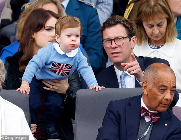 Princess Eugenie's husband Jack Brooksbank is determined to show that his own business is very much a family business.  Pictured: Princess Eugenie, August and Jack Brooksbank attend the 2022 Platinum Pageant