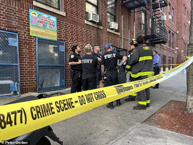 The police tape had been taken from the street and hung on the door of the Divino Nino Daycare on Morris Avenue.