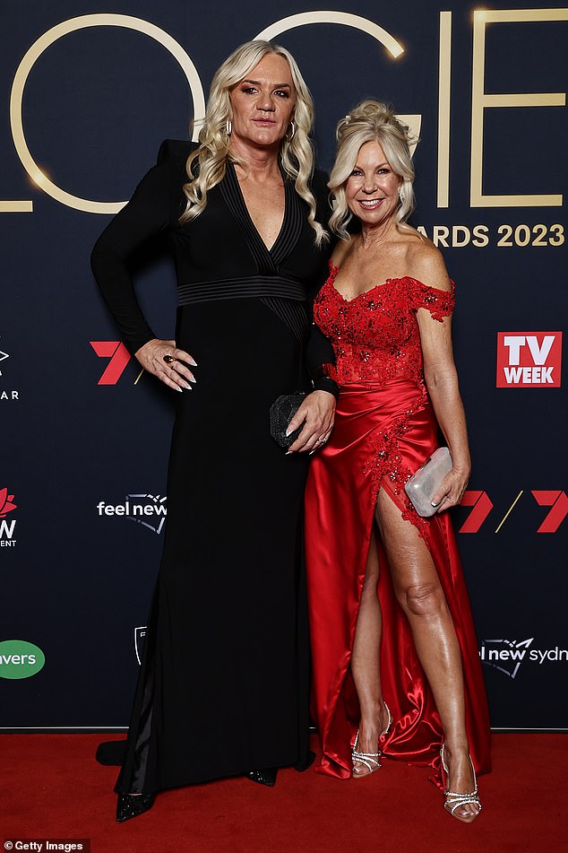 The former Kangaroos coach and star player (pictured with partner Donna Leckie in July) has an emotional reunion with her former teammates in Stan documentary Revealed - Danielle Laidley: Two Tribes