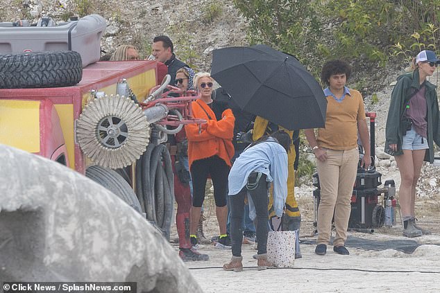 Good conditions?  Deborra-Lee Furness visited her estranged husband Hugh Jackman on the set of Deadpool in England just weeks before their split, never-before-seen photos reveal (Hugh pictured in the yellow suit)