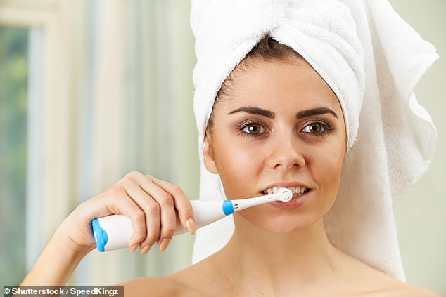 Dentists say everyone should brush their teeth for two minutes twice a day (stock image)