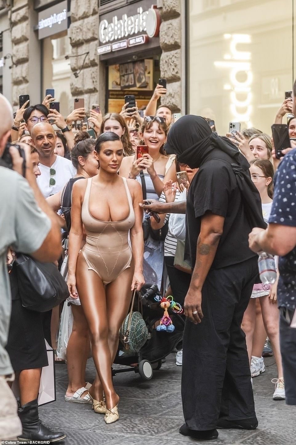 Frenzy: Kanye West and his new 'wife' Bianca Censori caused a frenzy while on Via dei Calzaiuoli in Florence, Italy on Thursday afternoon