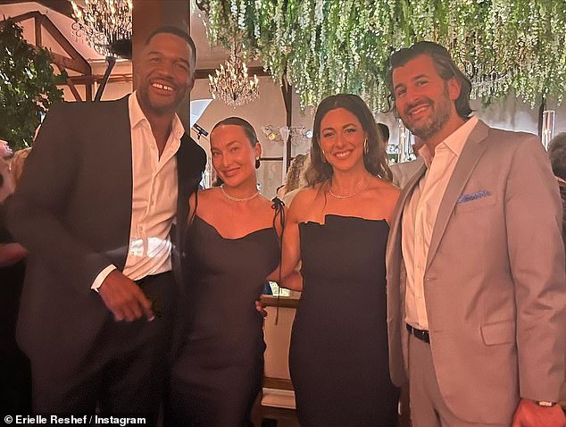 Pleasure!  Strahan is pictured on the far left, next to his girlfriend, Kayla Quick, at Roberts' wedding reception