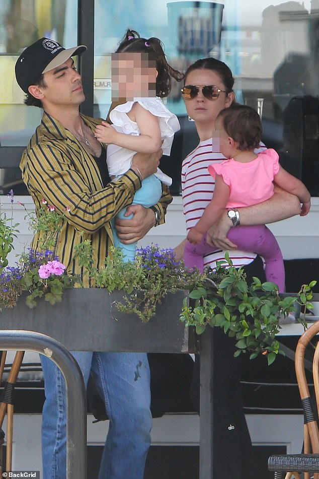 The couple was married for four years and share daughters, three-year-old Willa and one-year-old DJ.  The photo shows Jonas with his two daughters earlier this month