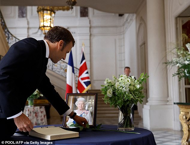 President Macron signs the book of condolence for the Queen after a moving speech in honor of Queen Elizabeth II