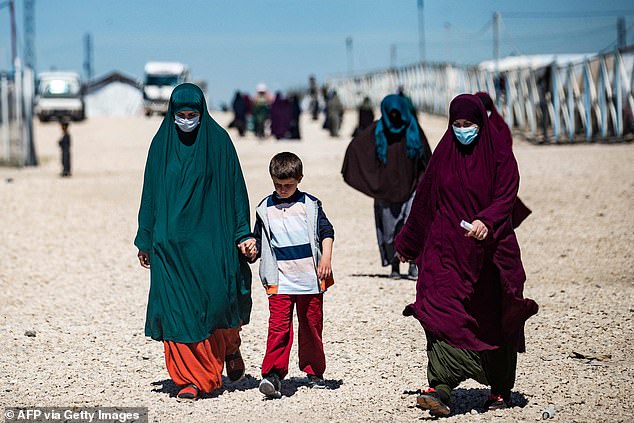 Eleven women and 20 children living in a refugee camp in Syria after the fall of ISIL today launched an extraordinary effort to return to Australia.  The photo shows women and children in the al-Roj detention camp in northeastern Syria