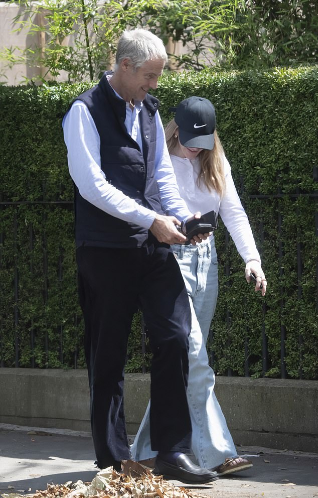 Gould enjoys a walk with Tory peer and environmental campaigner Zac Goldsmith in London in August