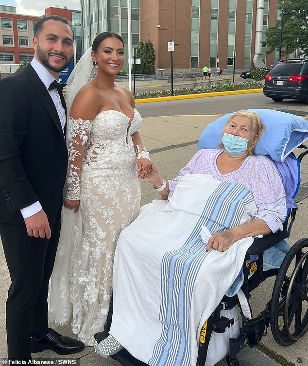 This is the sweet moment bride Jessica Colalillo, 24, surprised her bedbound grandmother in hospital, leaving her so elated she became 'hysterical'.  (Image: Jessica Colalillo, 24, and her longtime partner, Adam, 31, next to grandma Gemma Russo, 88)