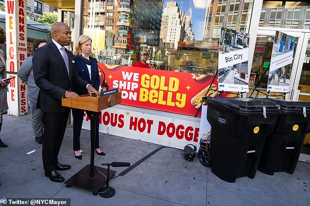 Eric Adams is seen Tuesday promoting a new trash system designed to reduce the rat problem.  He was asked if he was going to meet Joe Biden - who is in New York for the UN General Assembly - and he said Biden knew where to find him if he wanted to talk.